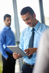 Image showing business man using tablet compuer at office