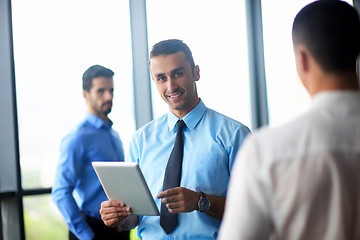 Image showing business man using tablet compuer at office