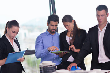 Image showing business people and engineers on meeting