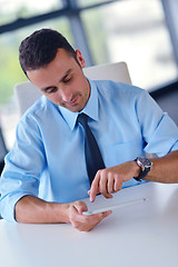 Image showing business man using tablet compuer at office