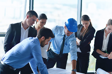 Image showing business people and engineers on meeting