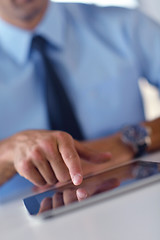 Image showing business man using tablet compuer at office