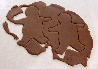 Image showing Two gingerbread men in cookie dough