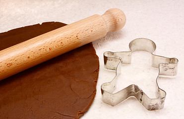 Image showing Gingerbread dough, rolling pin and cookie cutter