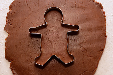 Image showing Cutting out a gingerbread man