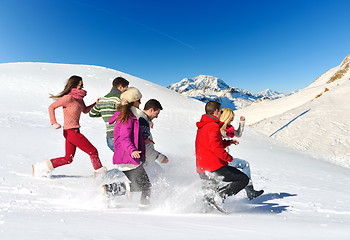 Image showing friends have fun at winter on fresh snow