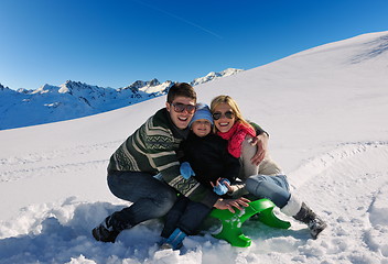 Image showing family having fun on fresh snow at winter vacation