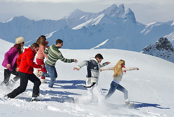 Image showing friends have fun at winter on fresh snow