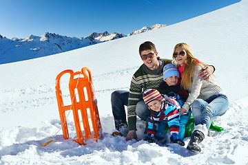 Image showing family having fun on fresh snow at winter vacation