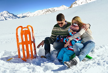 Image showing family having fun on fresh snow at winter vacation