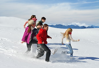 Image showing friends have fun at winter on fresh snow