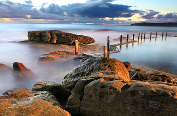 Image showing Dawn coastline and Mahon Rock Pool