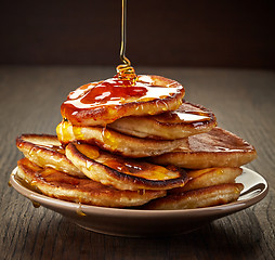 Image showing pancakes with maple syrup on plate