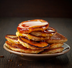 Image showing pancakes with maple syrup on plate