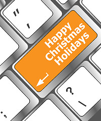 Image showing happy christmas holidays button on computer keyboard key