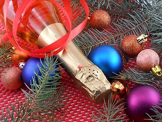 Image showing champagne wine bottle with christmas ball and red ribbon