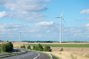 Image showing Wind generator turbine on summer landscape