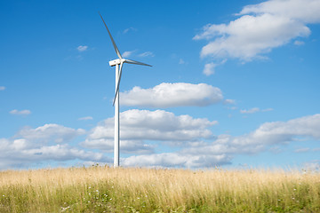 Image showing Wind generator turbine on summer landscape