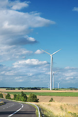 Image showing Wind generator turbine on summer landscape