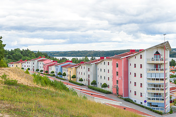 Image showing Colorful residential neighborhood surrounded by nature