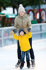 Image showing family ice skating