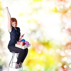 Image showing Emotional smiling woman with boxes gifts 