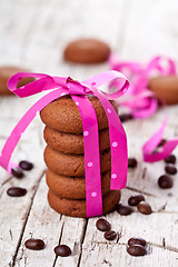 Image showing chocolate cookies tied with pink ribbon and coffee beans 