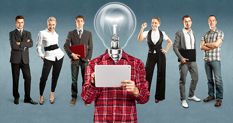 Image showing Business Team With Lamp Head