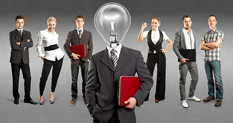 Image showing Business Team With Lamp Head