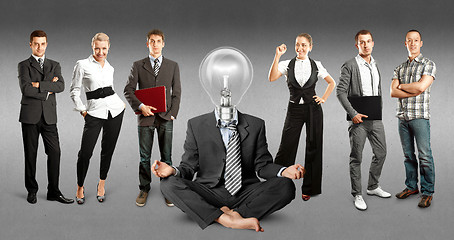 Image showing Business Team With Lamp Head