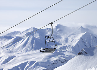 Image showing Chair lifts and off-piste slope in fog