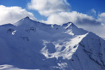 Image showing Off piste slope for heliskiing and helicopter in evening