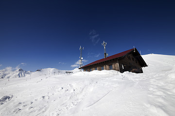 Image showing Wooden hotel at snowy mountains