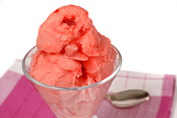 Image showing Glass of cherry sherbert on a red and white napkin