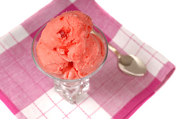 Image showing Overhead view of a lass of cherry sherbert on a red and white na