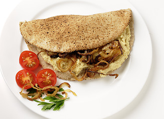 Image showing Hummus and fried onion pita sandwich