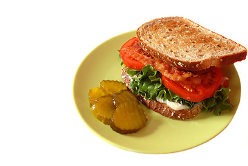 Image showing A bacon, lettuce and tomato sandwich with pickles isolated on wh