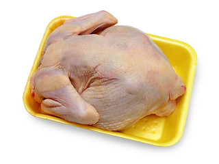 Image showing hen ready to preparation on a yellow substrate