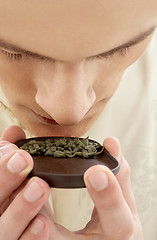 Image showing tea ceremony master smelling green tea