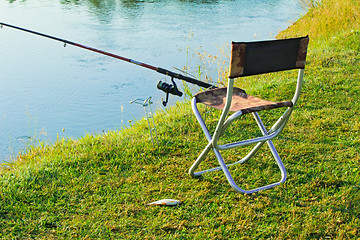 Image showing Comfortable place for fishing at the river and caught fish