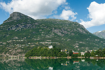Image showing Mountains and village on the lake