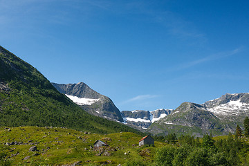 Image showing Norwegian landscape with mountains covered by snow