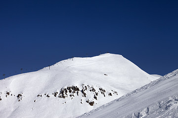 Image showing Ski slope and ropeway at nice winter day