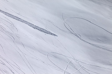 Image showing Off piste slope with traces of skis, snowboarding and avalanche