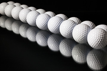 Image showing Golf balls on the black background