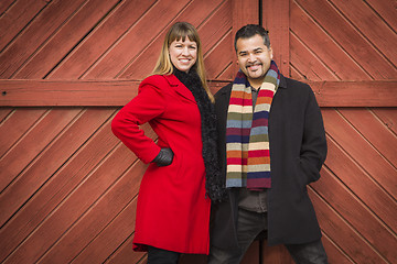 Image showing Mixed Race Couple Portrait in Winter Clothing Against Barn Door