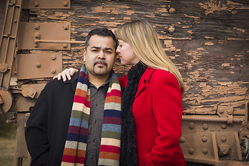 Image showing Mixed Race Couple Portrait in Winter Clothing Against Rustic Tra