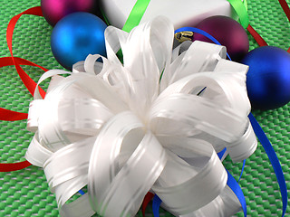 Image showing Christmas balls, white gift box and holiday bow