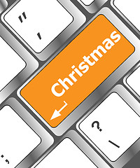 Image showing christmas button on the keyboard key - holiday concept