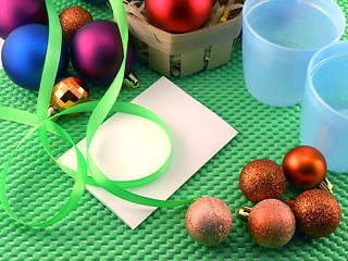 Image showing Christmas balls on green background, new year decoration